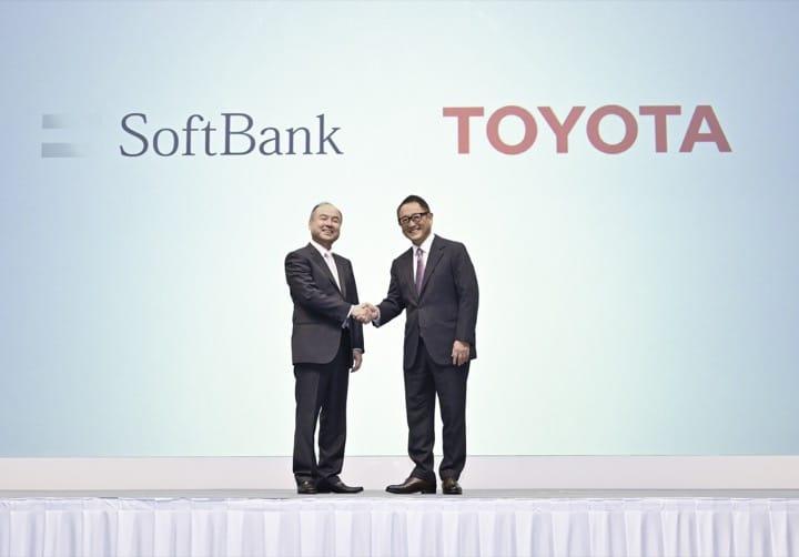 Akio Toyoda shakes hands with Masayoshi Son of Softbank